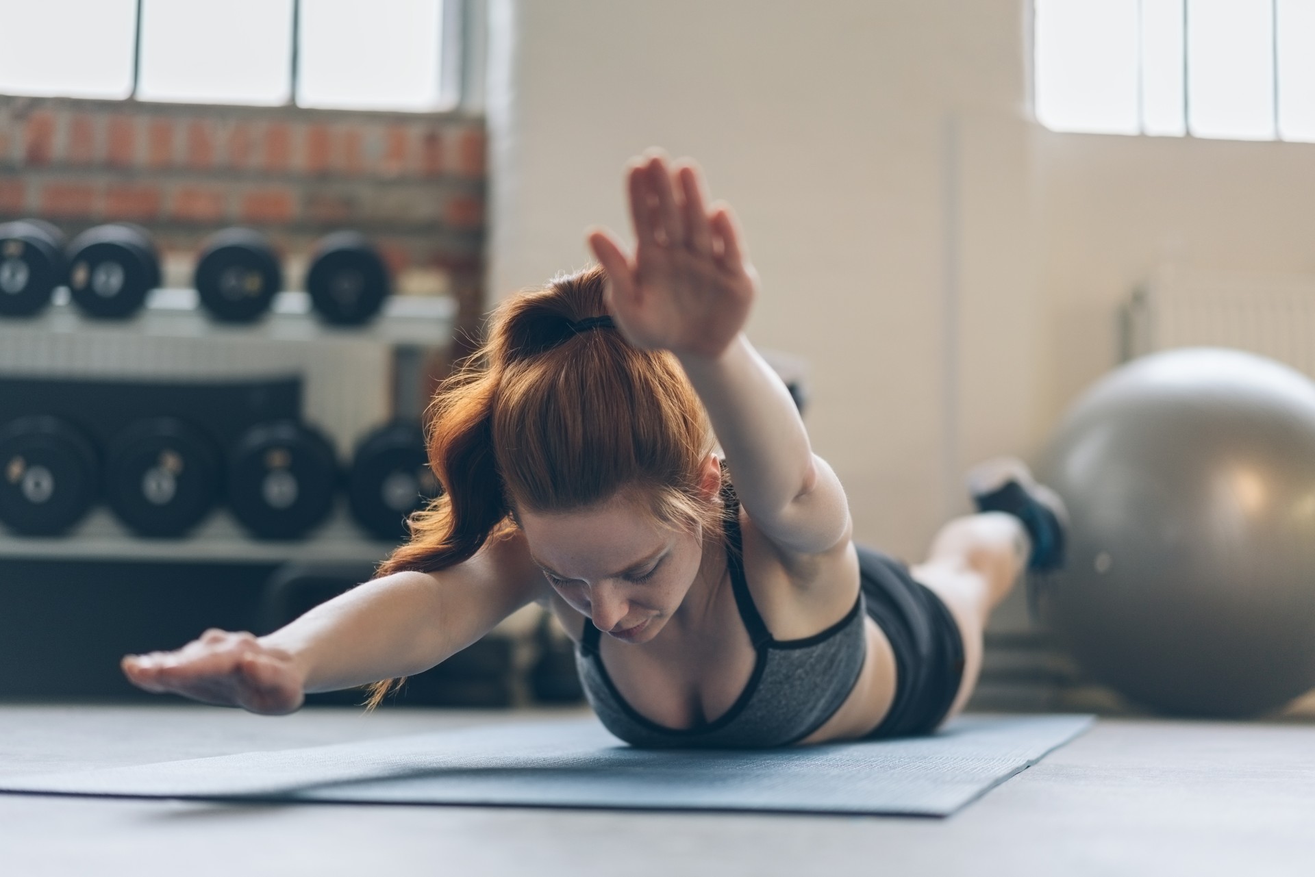 Young woman toning her abdominal muscles